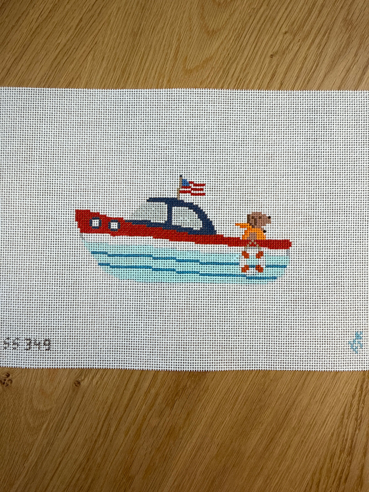 Chocolate Labrador in a Speedboat