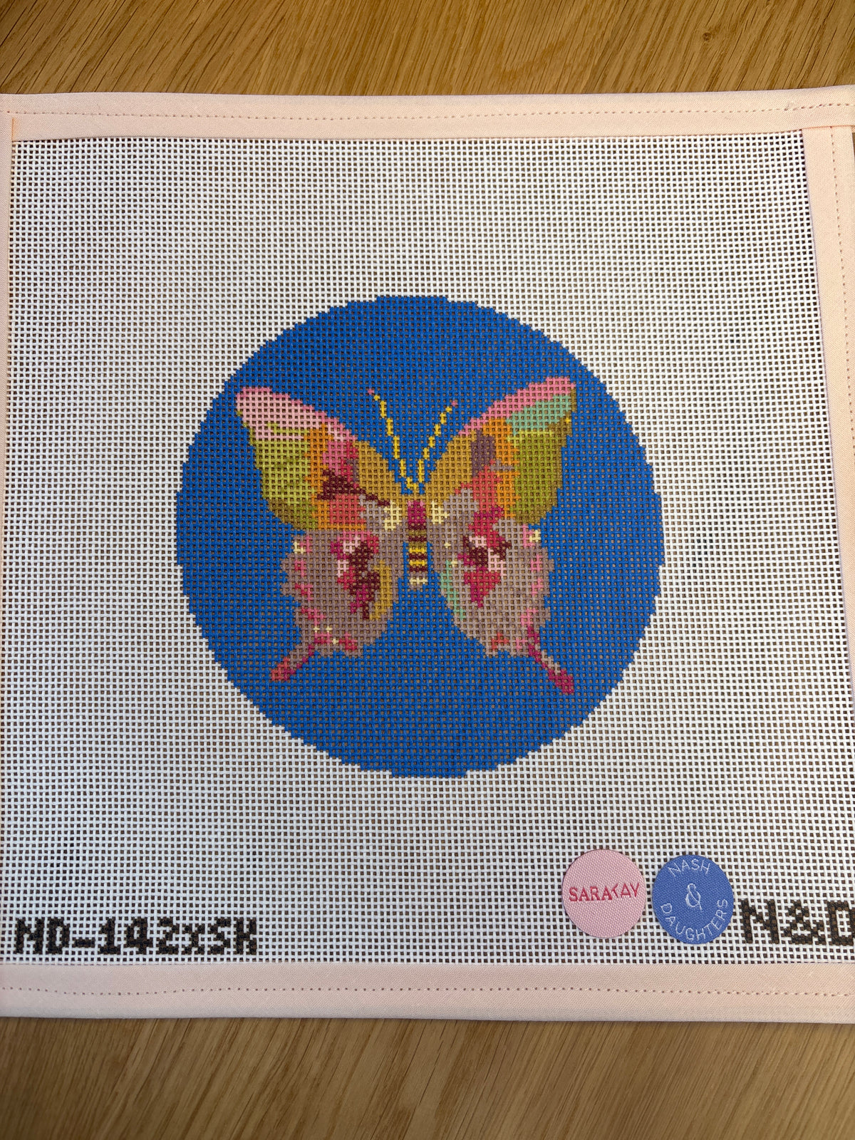 Gold and Green Butterfly on Blue